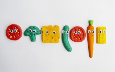 play-dough-background-with-vegetables-top-view